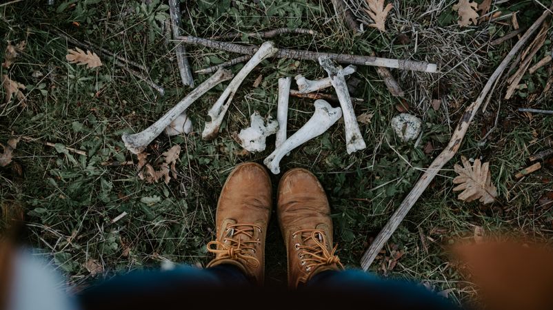 Standing person and chicken bones