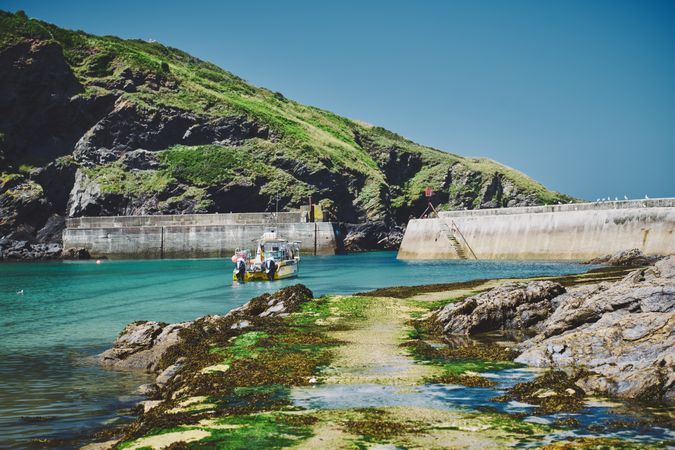 Fishing boat parked under the cliffs in Cornwall