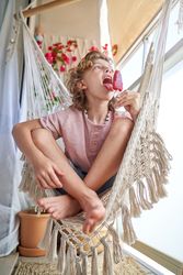 Charming adorable kid licking delicious ice cream