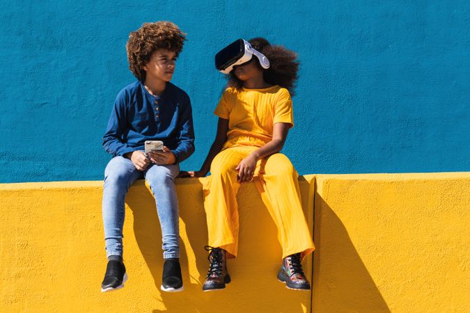 Black teenagers using modern gadgets