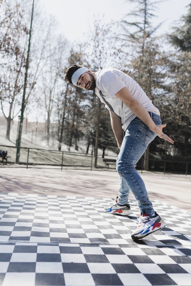 Man dancing break dance in park