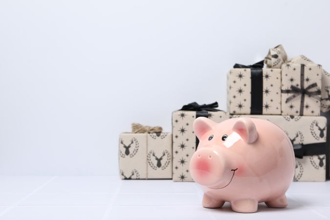 Concept of Christmas finance with piggy bank, space for text