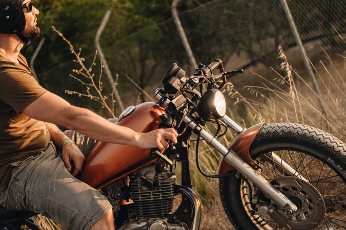 Strong man driving motorcycle