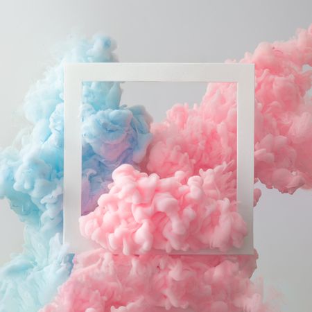 Cloud-like pastel pink and blue color paint with light  frame on  light  background