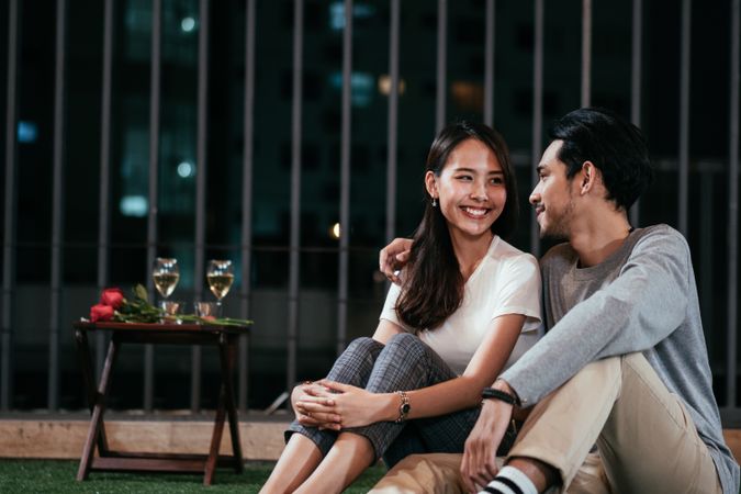 Asian boyfriend embrace girlfriend while looking into her eyes