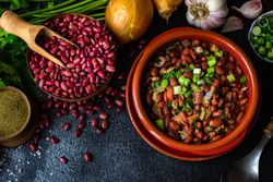 Top view of traditional Georgian dish lobio surrounded by ingredients