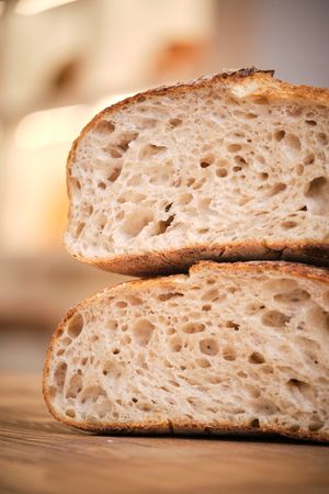 Still life photo of rustic bread on a wooden background with nat