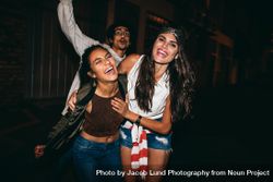 Portrait of three young friends having party outdoors 5z8eXb