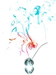 Jar with herbs emitting smoke