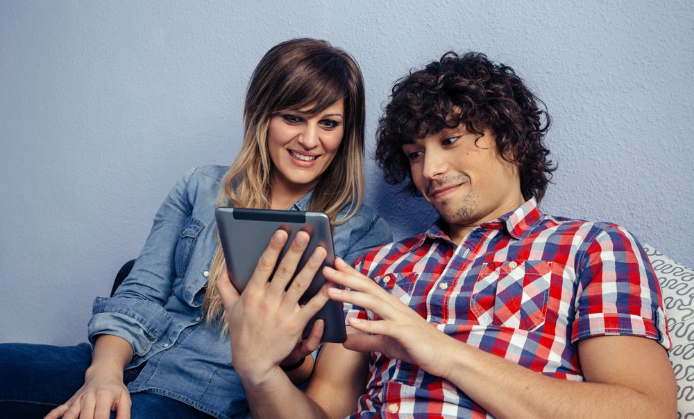Couple looking at the tablet