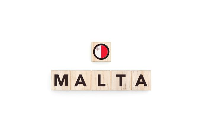 Wooden blocks bearing the name and flag of Malta.