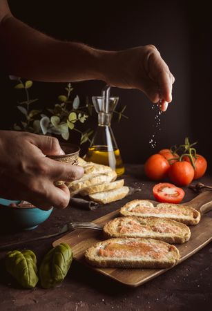 Crop cook salting delicious toasts