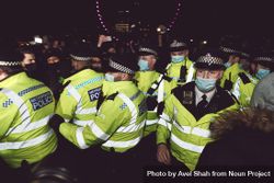 London, England, United Kingdom - March 16, 2021: Metropolitan Police officers at protest 5wrEm0