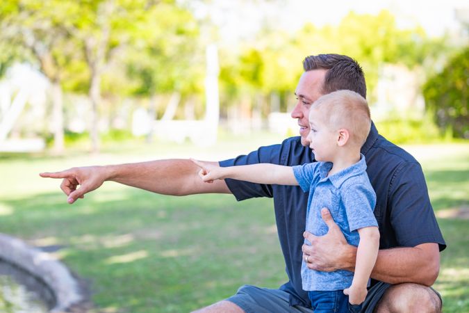 Father and Son Having Fun At The Park