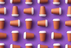 Pattern of disposable coffee cups on purple background