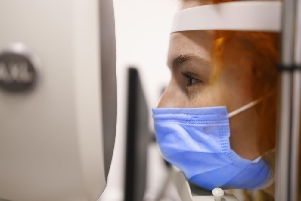 Close up of woman having her eyes checked by machine