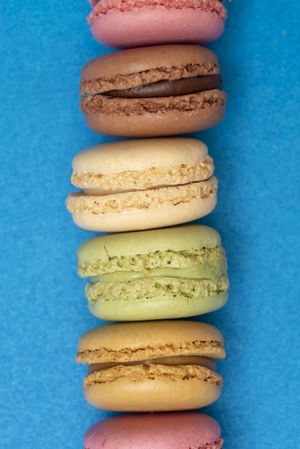French pastel macaroons on a blue table