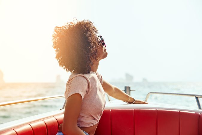 Contemplative woman pictured on a boat