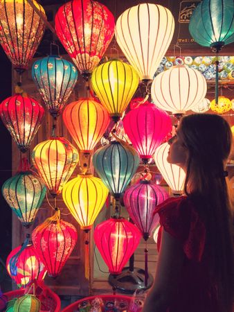 Woman looking at colorful lantern