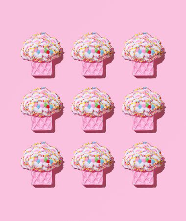 Cute muffin toys on pink background