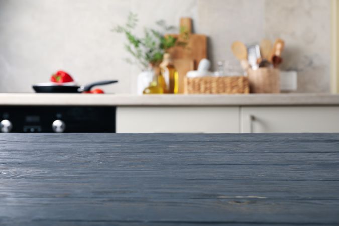 Wood table on blur kitchen room background