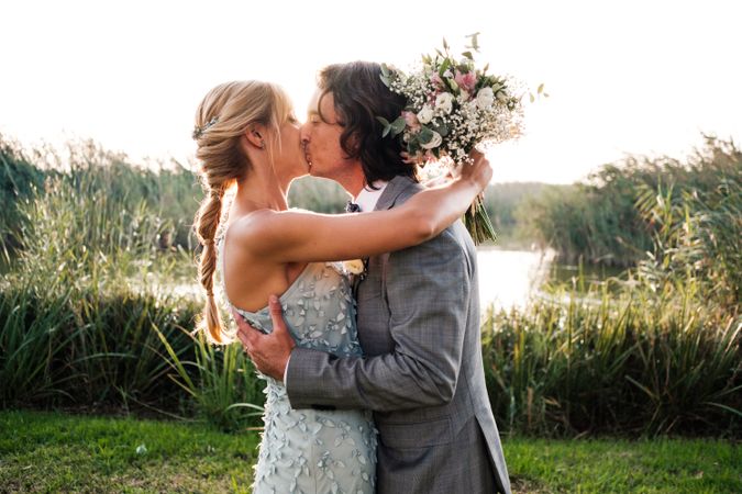 Happy newly wedded couple delighting in event at nature