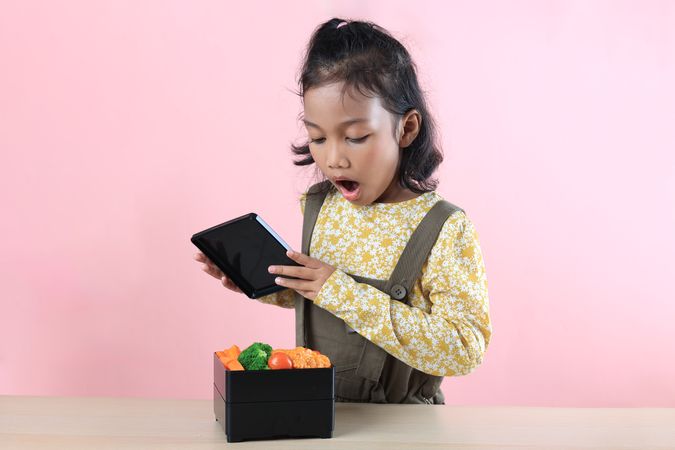 Little Asian Girl Surprised  When Opened Lunch Box