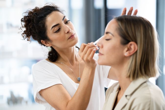 Woman having her make up professionally applied