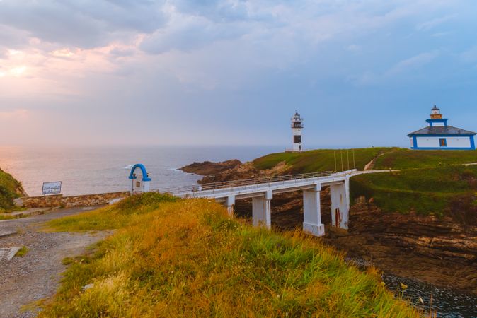 Amazing lighthouse on cliff near sea