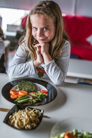 Girl waiting to eat vegan food at home