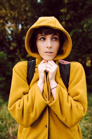 Frozen woman wrapping in coat