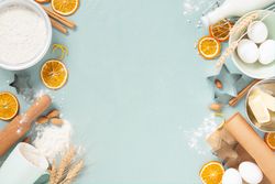 Raw ingredients for baking framing blue background