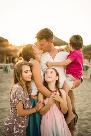 Beautiful happy family with children on beach