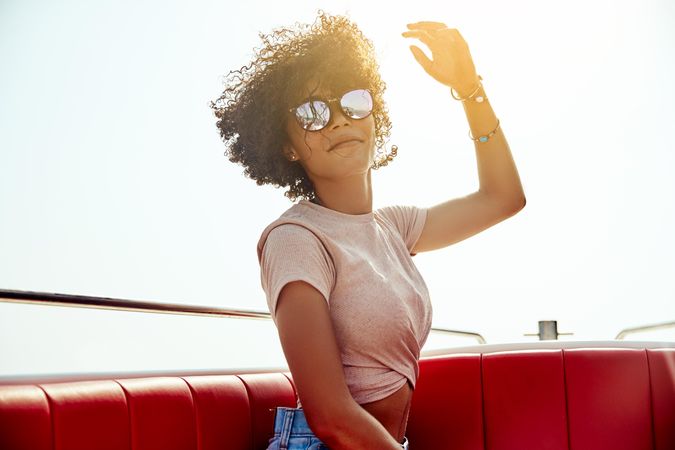 Woman in sunglasses posing on boat