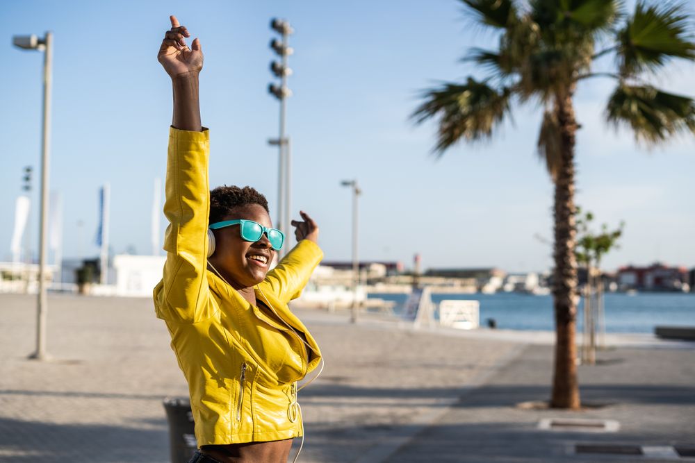 Joyful female smiling and jumping