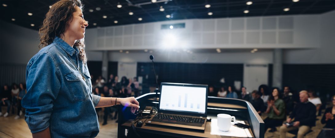 Businesswoman giving a presentation at a corporate event