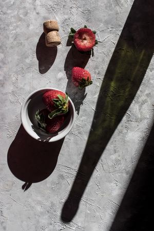 Strawberries near bottle of drink