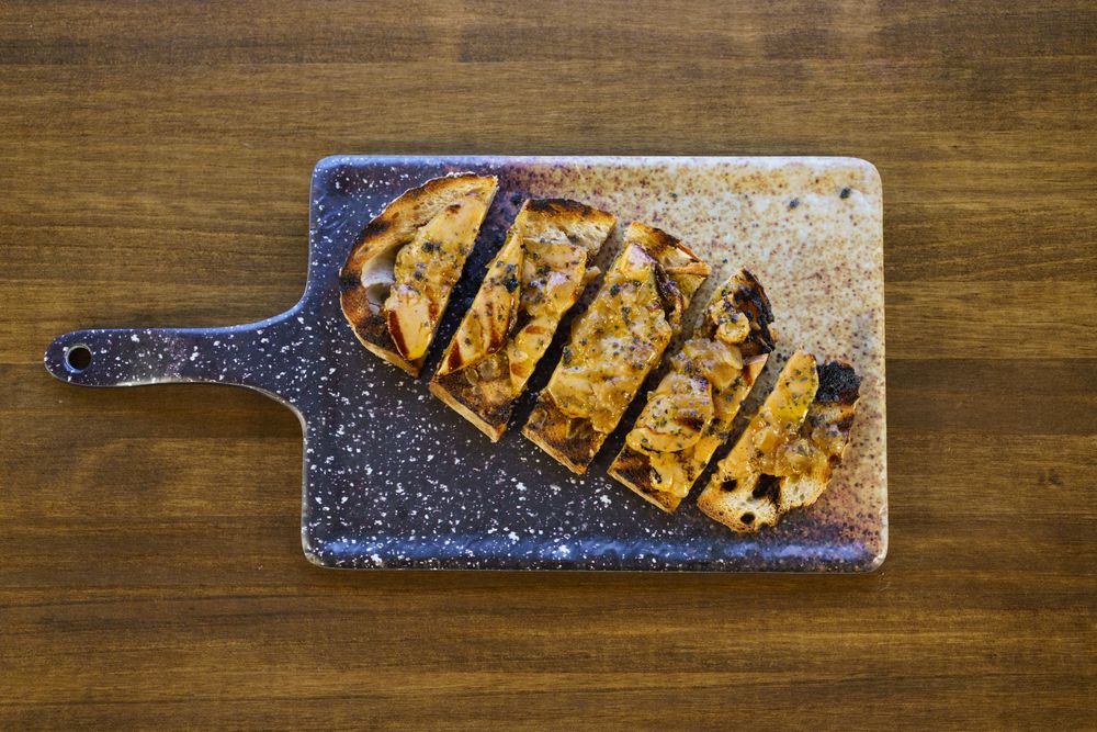 Top view of pate on a piece of toast served in restaurant