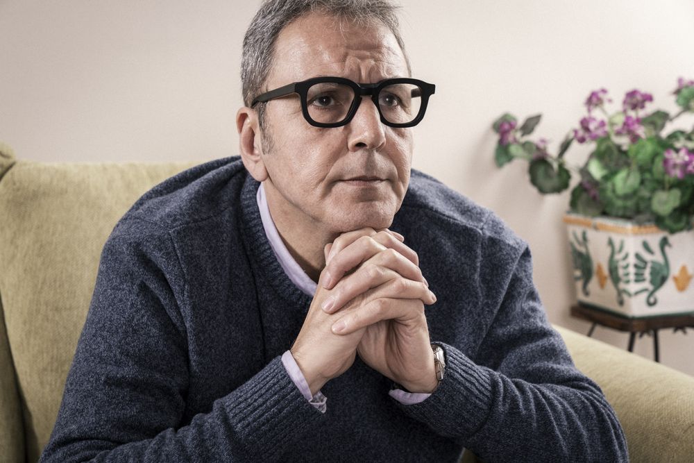 Serious man with glasses looking directly at the camera.
