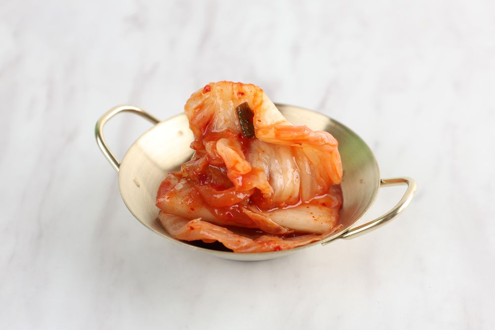 Close Up Korean Kimchi Cabbage on Small Plate