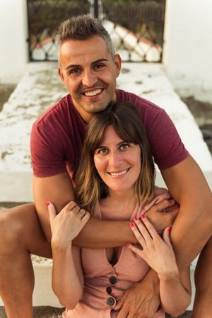 Adult couple hugging on steps