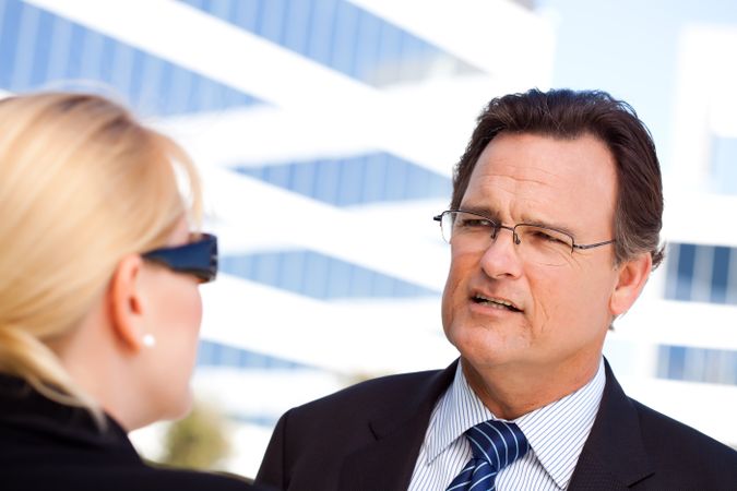 Businessman Talking with Female Colleague