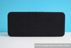 Single bluetooth speaker in blue studio shoot 48Ba8R