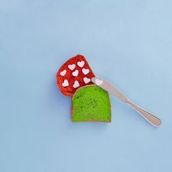 Tosted bread in vibrant colors with hearts on it