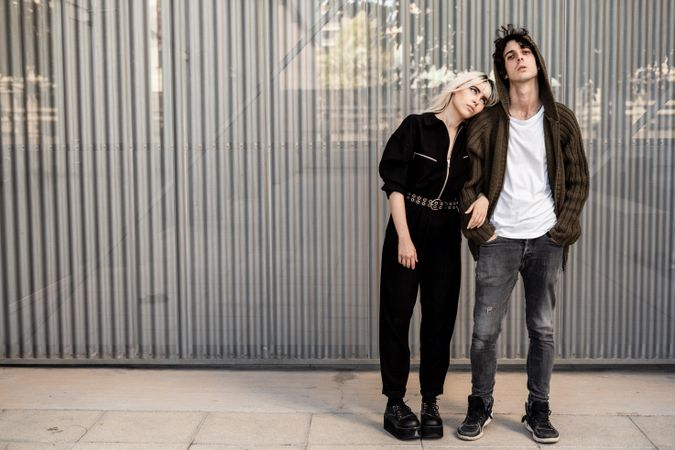 Couple near stripped modern building