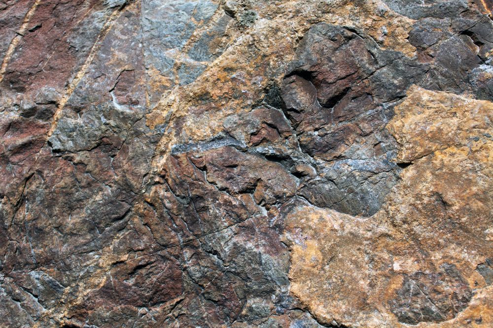 Dark and light brown rock face