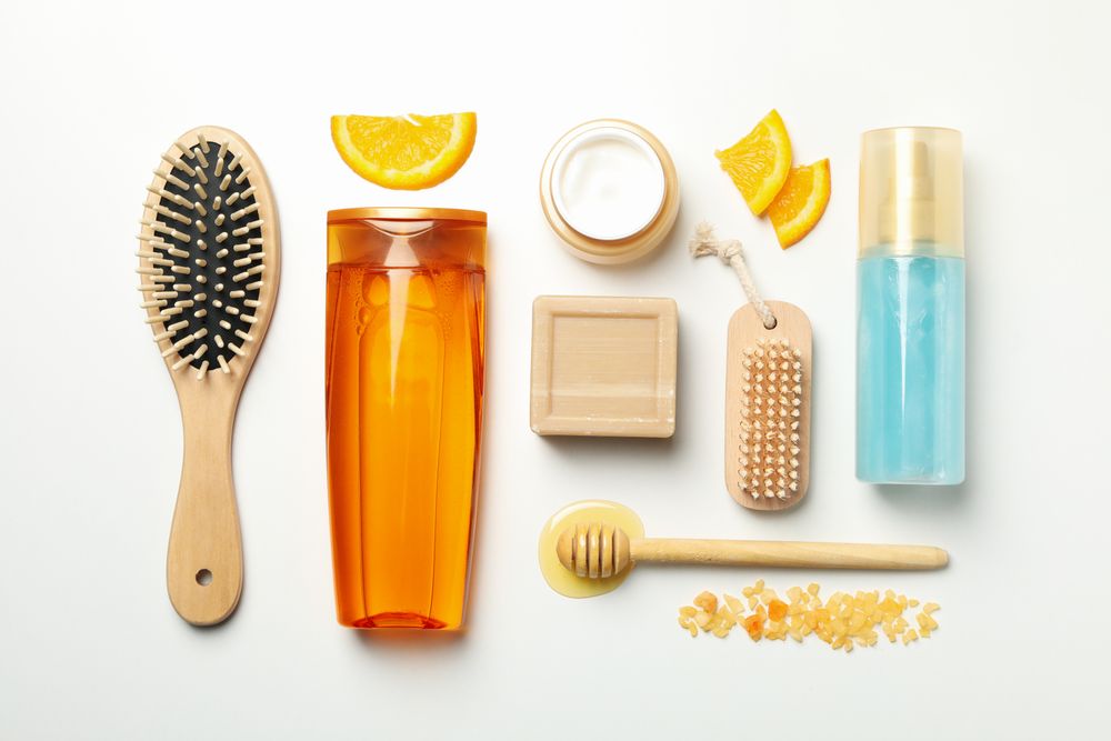Flat lay with cosmetics and natural ingredients on light background