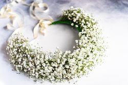 Headdress of gypsophila paniculata flowers on marble table