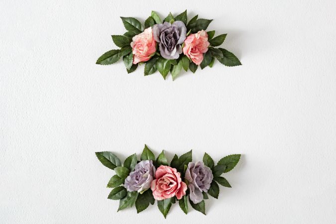 Pink and purple flowers and leaves on bright background