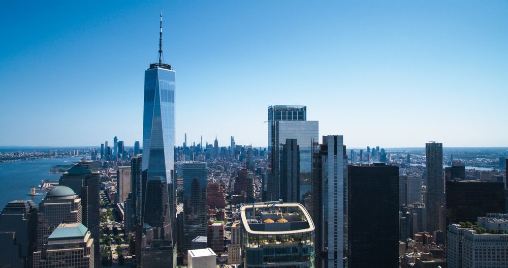 Scenic Aerial New York City View of Lower Manhattan Architecture. Panoramic Wall Street Financial District Shot from a Helicopter. Cityscape with Office Buildings and Skyscrapers